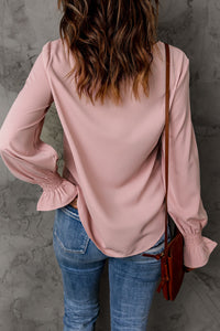 Blusa con cuello redondo y mangas con volantes