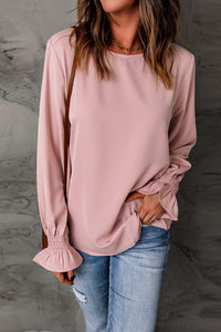 Blusa con cuello redondo y mangas con volantes